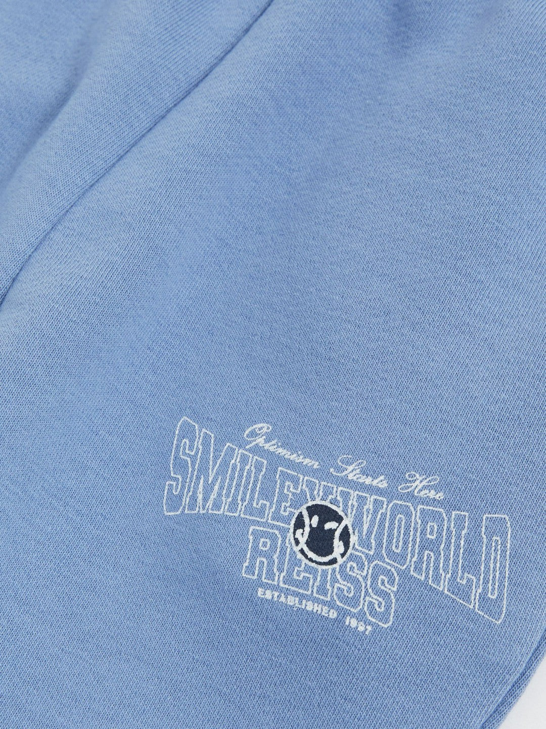 9-13 yrs SmileyWorld Cuffed Joggers Unisex Fit in Blue Children & Baby | Reiss
