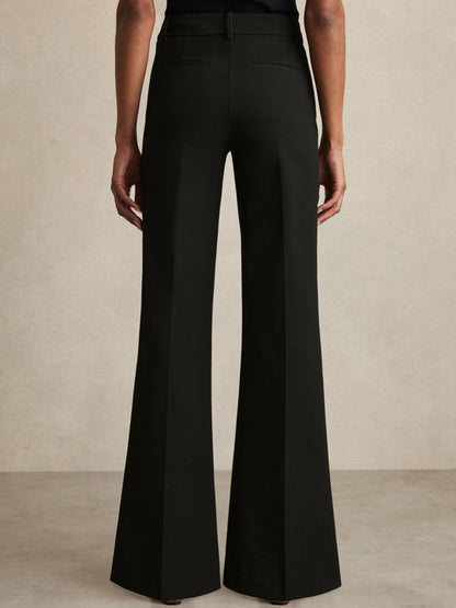 Petite High Rise Flared Trousers in Black Women | Reiss