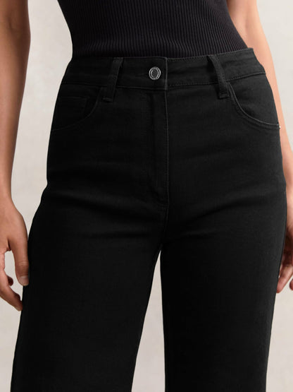 Petite Mid-Rise Flared Jeans in Black Women | Reiss