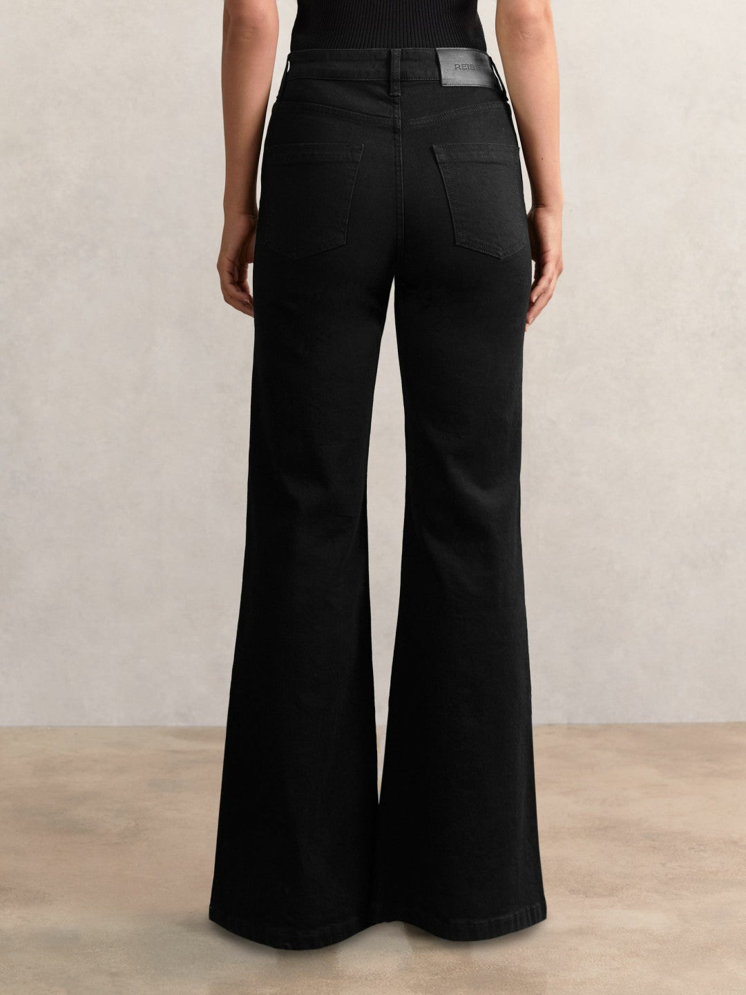 Petite Mid-Rise Flared Jeans in Black Women | Reiss