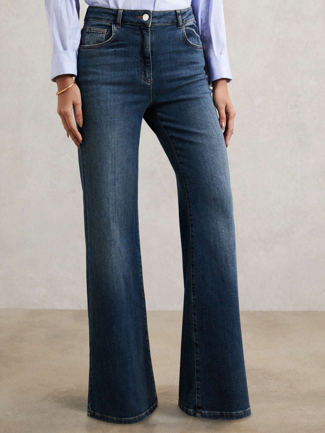 Petite Mid-Rise Flared Jeans in Mid Blue Women | Reiss