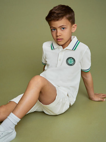13-14 yrs SmileyWorld Piqué Polo Shirt in White Children & Baby | Reiss