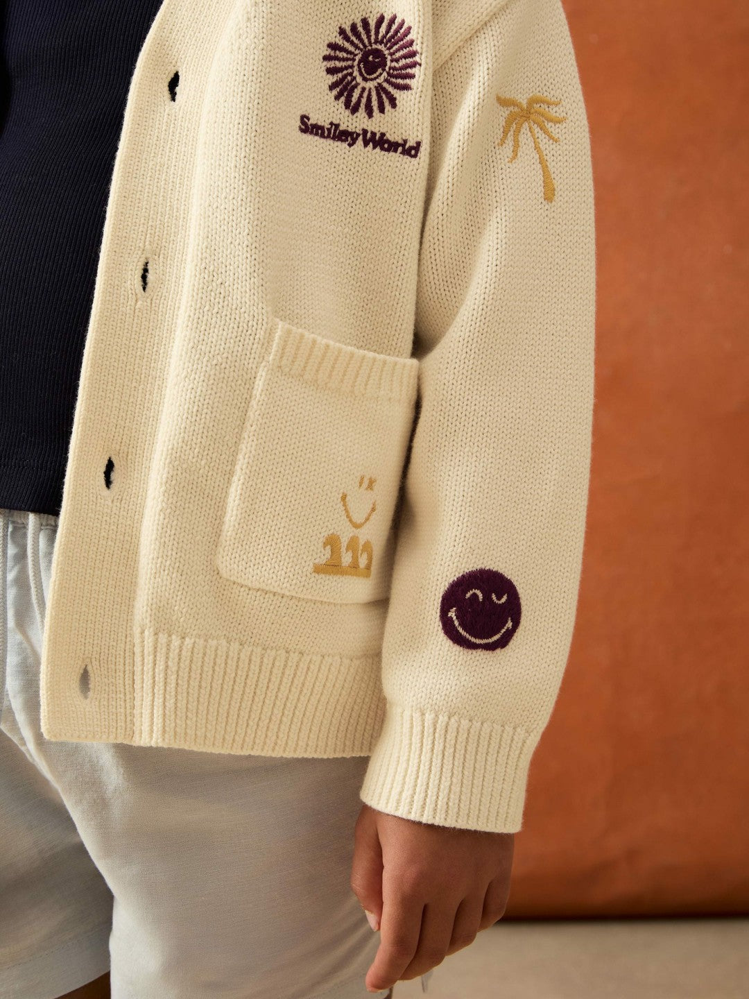 4-9 yrs SmileyWorld Embroidery Cardigan Unisex Fit in Off White Children & Baby | Reiss