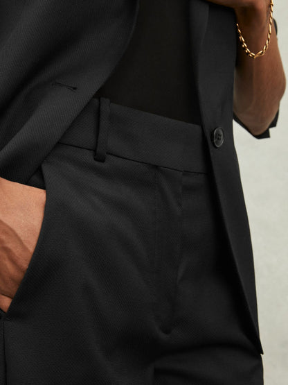 Wool-Blend Tailored Flared Suit Trousers in Black Women | Reiss