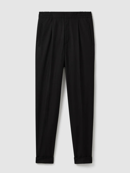 Relaxed-Fit Pleated Tapered Trousers in Black Men | Reiss