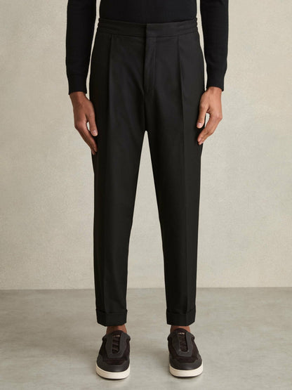 Relaxed-Fit Pleated Tapered Trousers in Black Men | Reiss