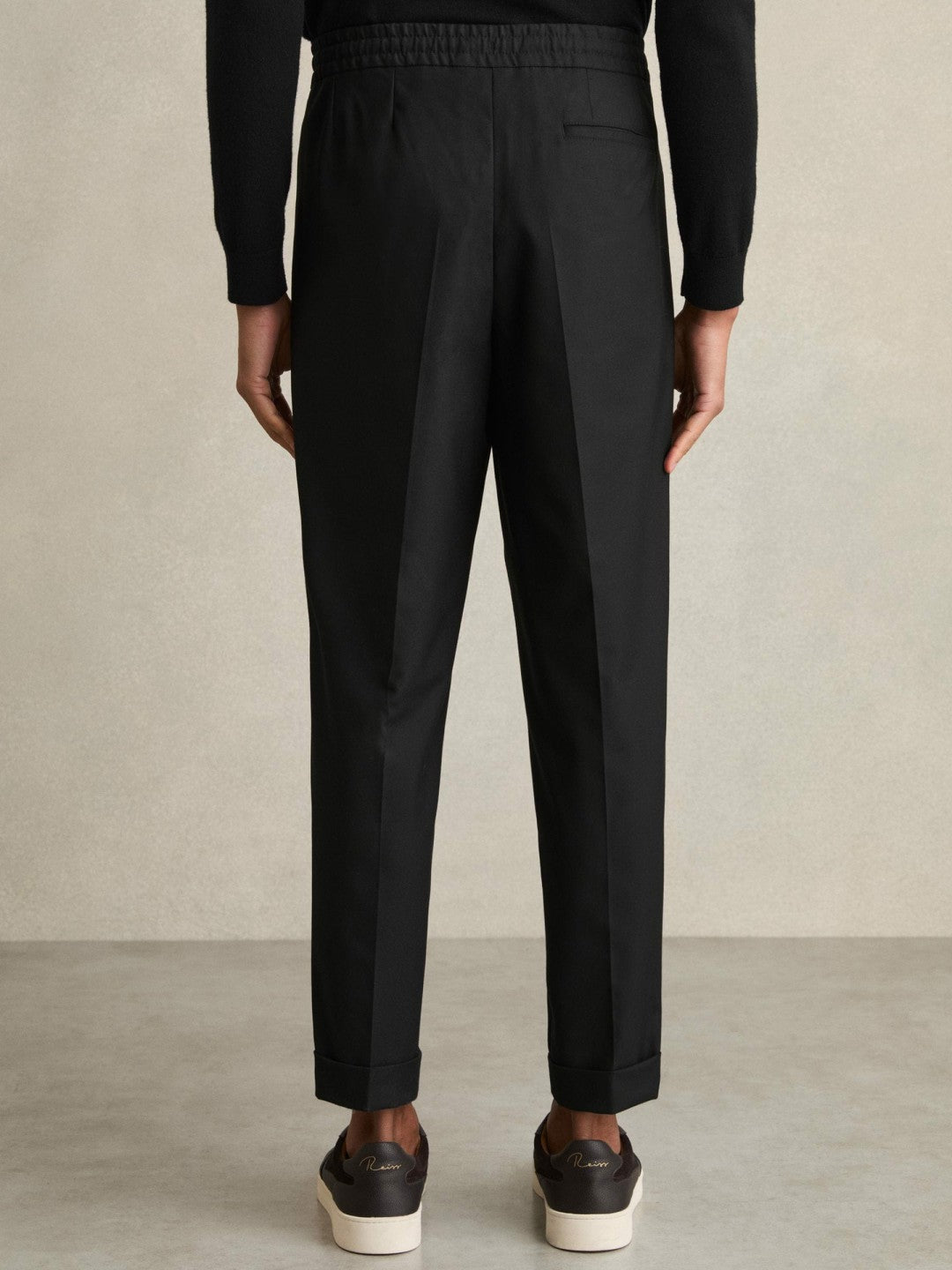 Relaxed-Fit Pleated Tapered Trousers in Black Men | Reiss