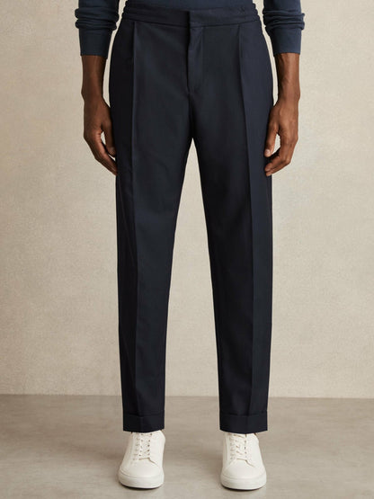 Relaxed-Fit Pleated Tapered Trousers in Navy Men | Reiss