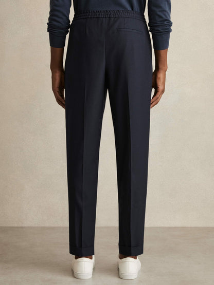 Relaxed-Fit Pleated Tapered Trousers in Navy Men | Reiss