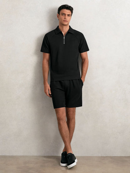Textured Raglan Half-Zip Polo Shirt in Black Men | Reiss