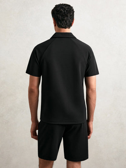 Textured Raglan Half-Zip Polo Shirt in Black Men | Reiss