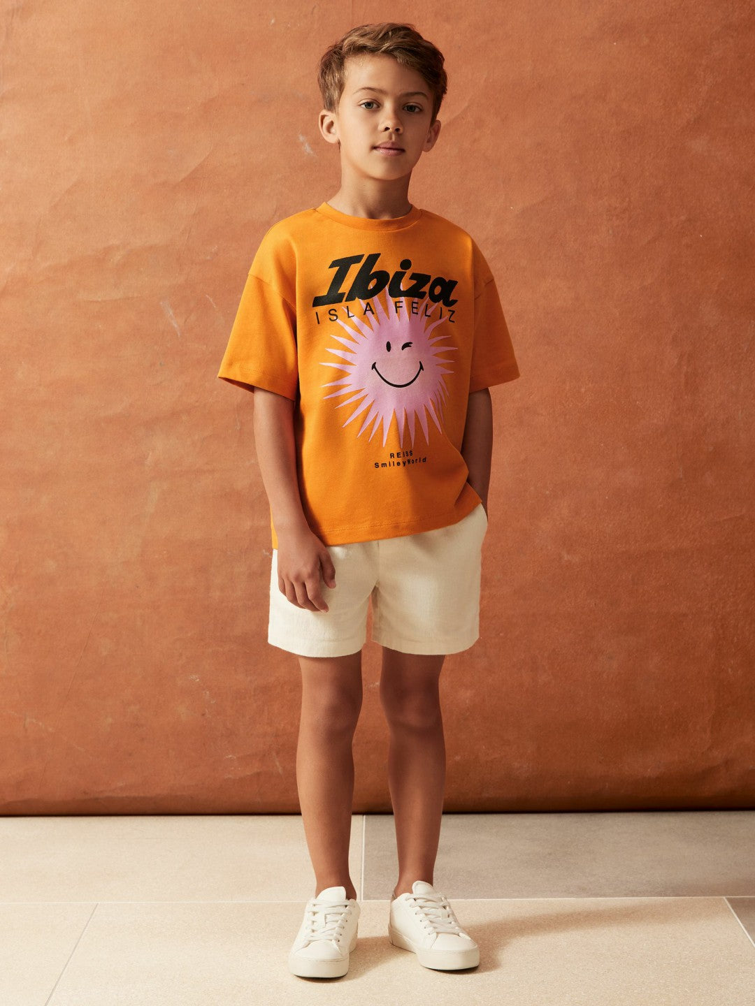 3-9 yrs SmileyWorld Sun Motif T-Shirt in Orange Children & Baby | Reiss